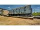 Modern townhomes featuring garages and private balconies, showcasing the exterior design and community layout at 816 Berne St # 3, Atlanta, GA 30316