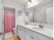 Bright bathroom boasts double vanity, large mirror, and playful pink polka dot shower curtain at 90 Citrine Way, Acworth, GA 30101