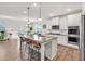 Modern kitchen with a large island, granite countertops, stainless steel appliances, and an open layout at 90 Citrine Way, Acworth, GA 30101
