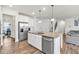 Bright kitchen with an island, stainless steel appliances, granite countertops, and seamless access to other living areas at 90 Citrine Way, Acworth, GA 30101