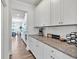 Spacious kitchen with granite counters, stainless appliances, white cabinets, and plenty of storage space at 90 Citrine Way, Acworth, GA 30101