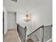 Staircase with decorative lighting and wrought iron railings at 90 Citrine Way, Acworth, GA 30101