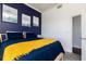 Bedroom featuring a comfortable queen bed, hardwood floors, and a closet at 3040 Peachtree Nw Rd # 1509, Atlanta, GA 30305