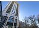 Modern high-rise building with balconies and a blue sky backdrop, showcasing urban living at its finest at 3040 Peachtree Nw Rd # 1509, Atlanta, GA 30305