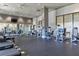 Spacious gym with state-of-the-art equipment, multiple ceiling fans, and mirrored wall for a full body workout at 3040 Peachtree Nw Rd # 1509, Atlanta, GA 30305