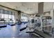 Fully equipped gym features modern cardio machines, weight training equipment, and large windows for a bright workout experience at 3040 Peachtree Nw Rd # 1509, Atlanta, GA 30305