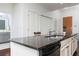 Kitchen with stainless appliances, granite countertops and a dishwasher, view of bathroom at 3040 Peachtree Nw Rd # 1509, Atlanta, GA 30305