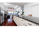 Kitchen island featuring granite countertops, stainless steel appliances, and seating area with balcony view at 3040 Peachtree Nw Rd # 1509, Atlanta, GA 30305