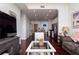 Open-concept living space with stainless steel appliances, breakfast bar, hardwood floors, and natural light at 3040 Peachtree Nw Rd # 1509, Atlanta, GA 30305