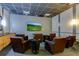Cozy media room offers plush seating, a large flat-screen TV, and a wet bar for an immersive entertainment experience at 3040 Peachtree Nw Rd # 1509, Atlanta, GA 30305