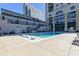 Stunning pool surrounded by sleek lounge chairs, steps from the building with city views, perfect for summer relaxation at 3040 Peachtree Nw Rd # 1509, Atlanta, GA 30305