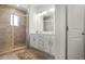 Elegant bathroom with glass shower, vanity, double sinks, and tiled floors at 4327 Water Elm Aly, Doraville, GA 30360