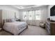 Bright primary bedroom with neutral decor, large windows and tray ceilings at 4327 Water Elm Aly, Doraville, GA 30360