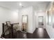Hallway with wood floors, stairs and handrail with a chair and decor mirror at 4327 Water Elm Aly, Doraville, GA 30360