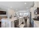 Open kitchen with a large island and view into the living room at 4327 Water Elm Aly, Doraville, GA 30360