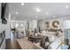 Spacious living room with modern decor, fireplace, and open access to the kitchen at 4327 Water Elm Aly, Doraville, GA 30360