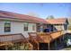 Spacious backyard deck perfect for outdoor entertaining with access to both the house and screened-in porch at 5010 Highway 20 Ne, Conyers, GA 30012