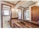 This full bathroom with marble countertop features lots of mirror and storage at 5010 Highway 20 Ne, Conyers, GA 30012