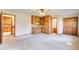 Spacious bedroom featuring kitchenette, storage cabinets, and easy access to the en suite bathroom at 5010 Highway 20 Ne, Conyers, GA 30012