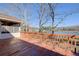 Outdoor deck with wooden railing overlooking the lake and trees at 5010 Highway 20 Ne, Conyers, GA 30012