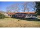 Charming single-story home with red shutters and a spacious front yard at 5010 Highway 20 Ne, Conyers, GA 30012