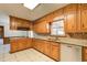 Spacious kitchen featuring wood cabinets, modern appliances, and granite countertops at 5010 Highway 20 Ne, Conyers, GA 30012