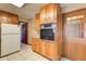 Functional kitchen layout with ample cabinet space, a built-in oven, and a door to the exterior at 5010 Highway 20 Ne, Conyers, GA 30012