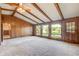 Bright living room offers natural light with wood accents and lake views at 5010 Highway 20 Ne, Conyers, GA 30012