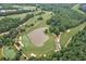 Bird's eye view of a golf course with a water feature, sand traps, and meticulously manicured greens at 5053 Chapel Xing, Douglasville, GA 30135