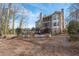 Large backyard featuring a pool, spa, and tiered patio; perfect for entertaining and enjoying the outdoors at 5053 Chapel Xing, Douglasville, GA 30135