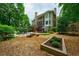 The property features a backyard oasis with a pool, fire pit, and mature trees at 5053 Chapel Xing, Douglasville, GA 30135