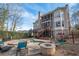 A spacious backyard with a pool, spa, fire pit, and comfortable seating, ideal for outdoor enjoyment at 5053 Chapel Xing, Douglasville, GA 30135