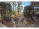 Stone path leading to a charming backyard with landscaping and a view at 5053 Chapel Xing, Douglasville, GA 30135