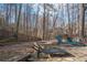 Spacious backyard with stone patio, fire pit, and relaxing lounge chairs at 5053 Chapel Xing, Douglasville, GA 30135