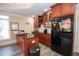 Wet bar featuring granite countertops, wood cabinets, and stainless steel appliances at 5053 Chapel Xing, Douglasville, GA 30135