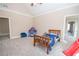 Spacious bedroom with neutral walls, gray carpet, and a vaulted ceiling with fan at 5053 Chapel Xing, Douglasville, GA 30135