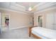 Bright bedroom with trey ceilings, ceiling fan, and neutral carpet at 5053 Chapel Xing, Douglasville, GA 30135