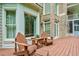 Relax on the backyard deck with wooden chairs and scenic views at 5053 Chapel Xing, Douglasville, GA 30135