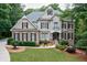 Charming two-story home with a beautifully landscaped front yard and classic architectural details at 5053 Chapel Xing, Douglasville, GA 30135