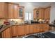 Charming kitchen features wood cabinets, granite countertops, stainless steel appliances, and ample counter space at 5053 Chapel Xing, Douglasville, GA 30135