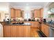 Charming kitchen with wood cabinets, granite countertops, island cooktop, and stainless steel appliances at 5053 Chapel Xing, Douglasville, GA 30135