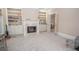 Cozy living room features a fireplace with built-in shelving and a plush carpet at 5053 Chapel Xing, Douglasville, GA 30135