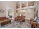 Spacious living room with high ceilings, plush seating, and elegant decor provides comfort at 5053 Chapel Xing, Douglasville, GA 30135