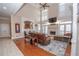 Sophisticated living room featuring high ceilings, a fireplace, and view of the kitchen at 5053 Chapel Xing, Douglasville, GA 30135