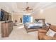Spacious carpeted bedroom with a king bed, ceiling fan, and natural light at 5053 Chapel Xing, Douglasville, GA 30135