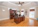 Beautifully appointed office featuring hardwood floors, a large desk, and ample natural light at 5053 Chapel Xing, Douglasville, GA 30135