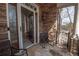Charming outdoor patio with stone walls and decorative glass door for luxurious curb appeal at 5053 Chapel Xing, Douglasville, GA 30135