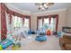 Spacious playroom with large windows, ceiling fan, and playful decor at 5053 Chapel Xing, Douglasville, GA 30135