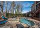 Inviting backyard pool and spa with stone patio, perfect for relaxation and outdoor enjoyment at 5053 Chapel Xing, Douglasville, GA 30135