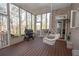 Relaxing sunroom with a swing and a grill for outdoor cooking at 5053 Chapel Xing, Douglasville, GA 30135